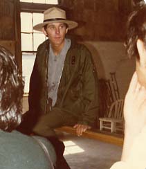 Ranger Bernardin pausing for questions in a part of the original Ellis tour area dedicated to medical topics.