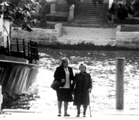 The woman on the right immigrated through Ellis; she returned in 1979 and was interviewed in a documentary being filmed that day. No name.